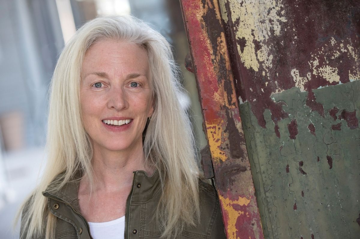 woman in jacket smiling