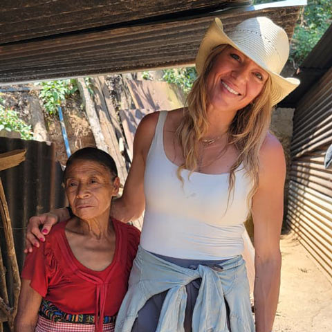 Heidi Johnson and a local pose for portrait