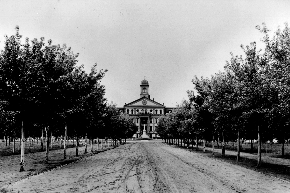 Main Hall stands in the distance circa 1920