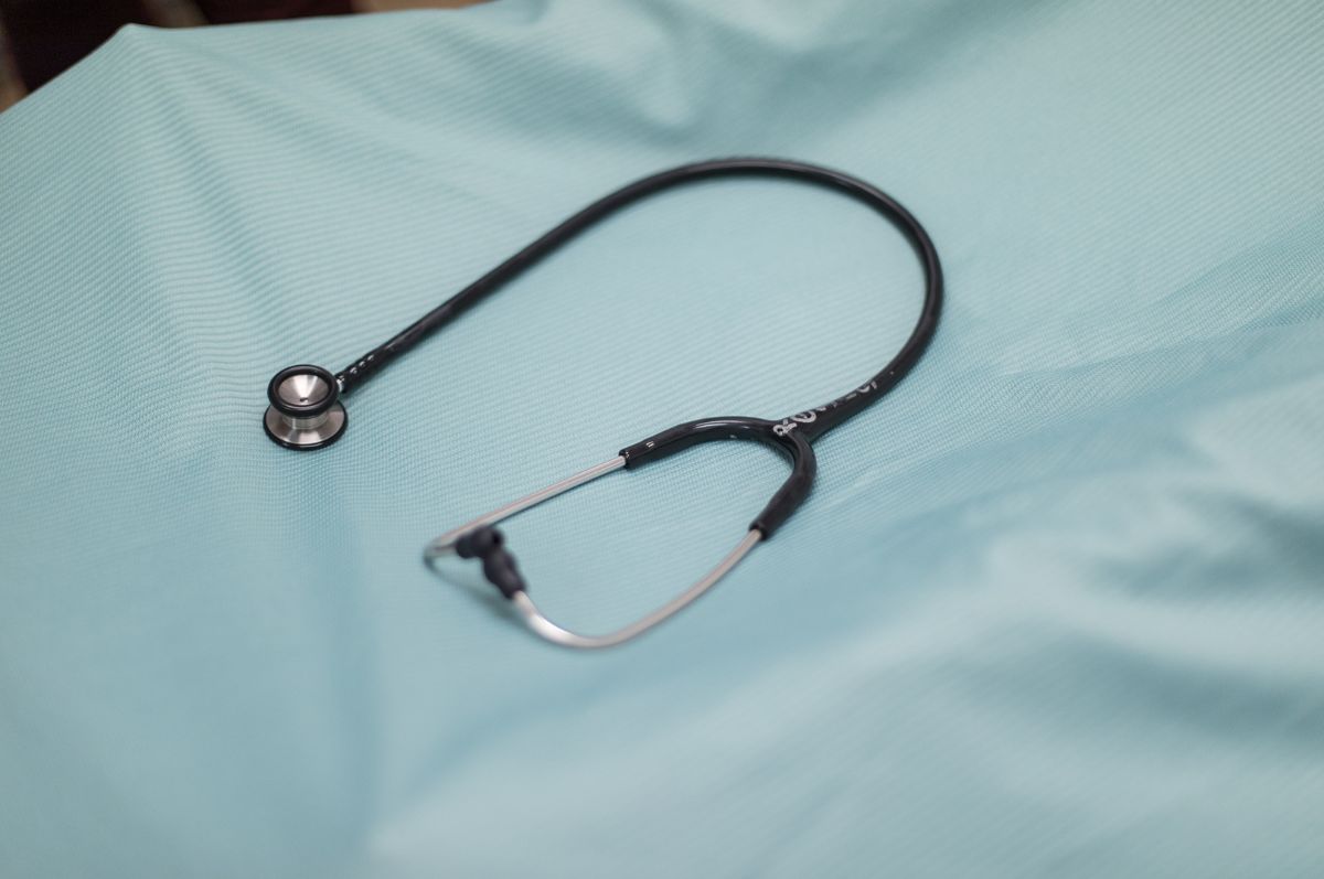 stethoscope over blue background