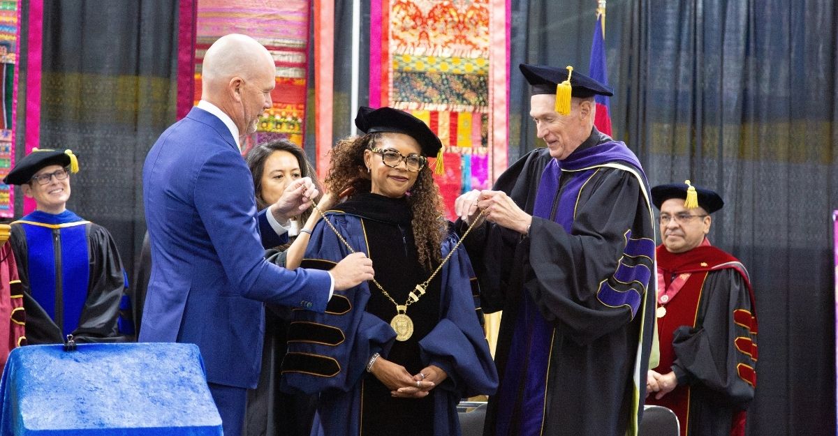 President Cooper Whitehead receiving her medal
