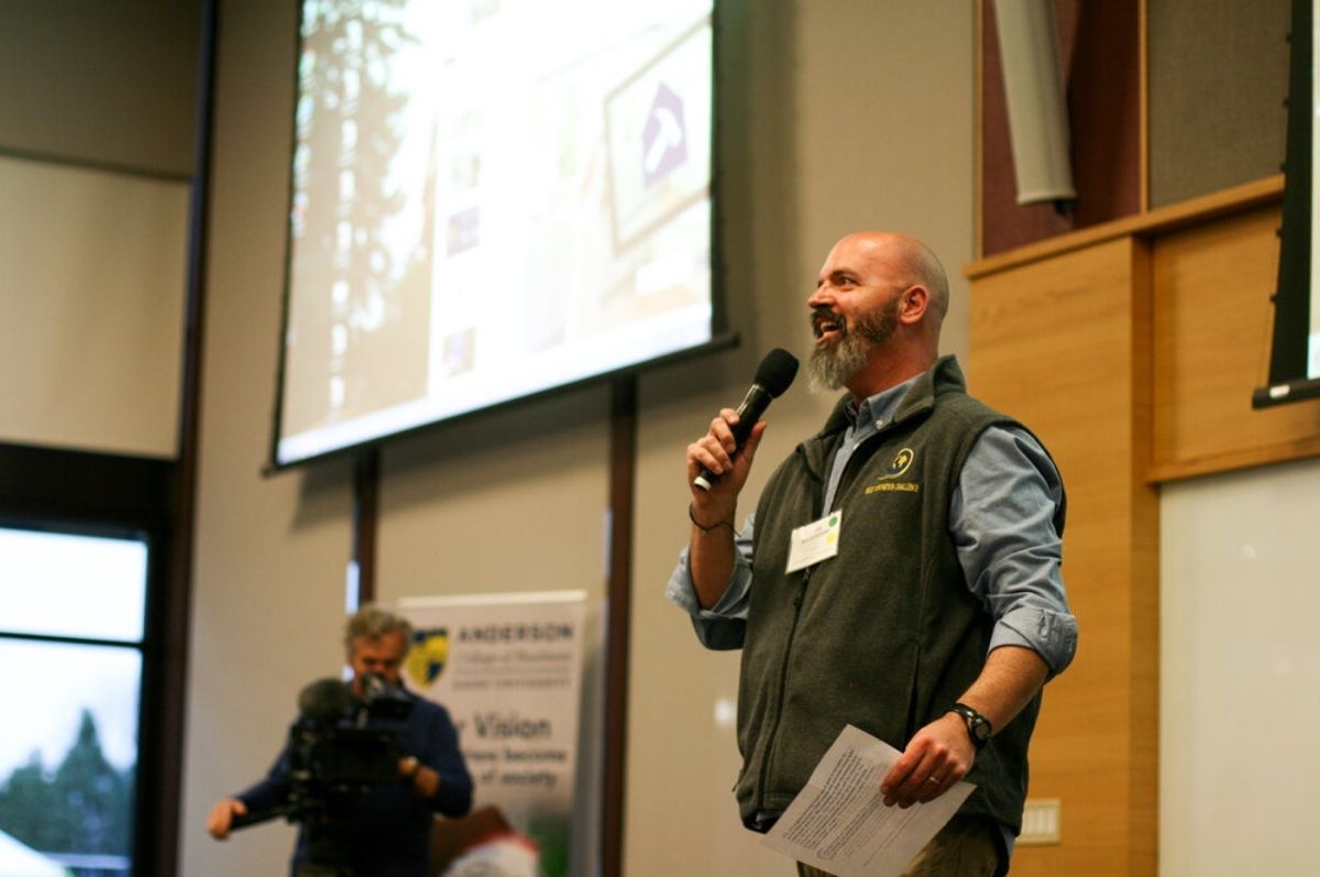 man speaking with microphone 