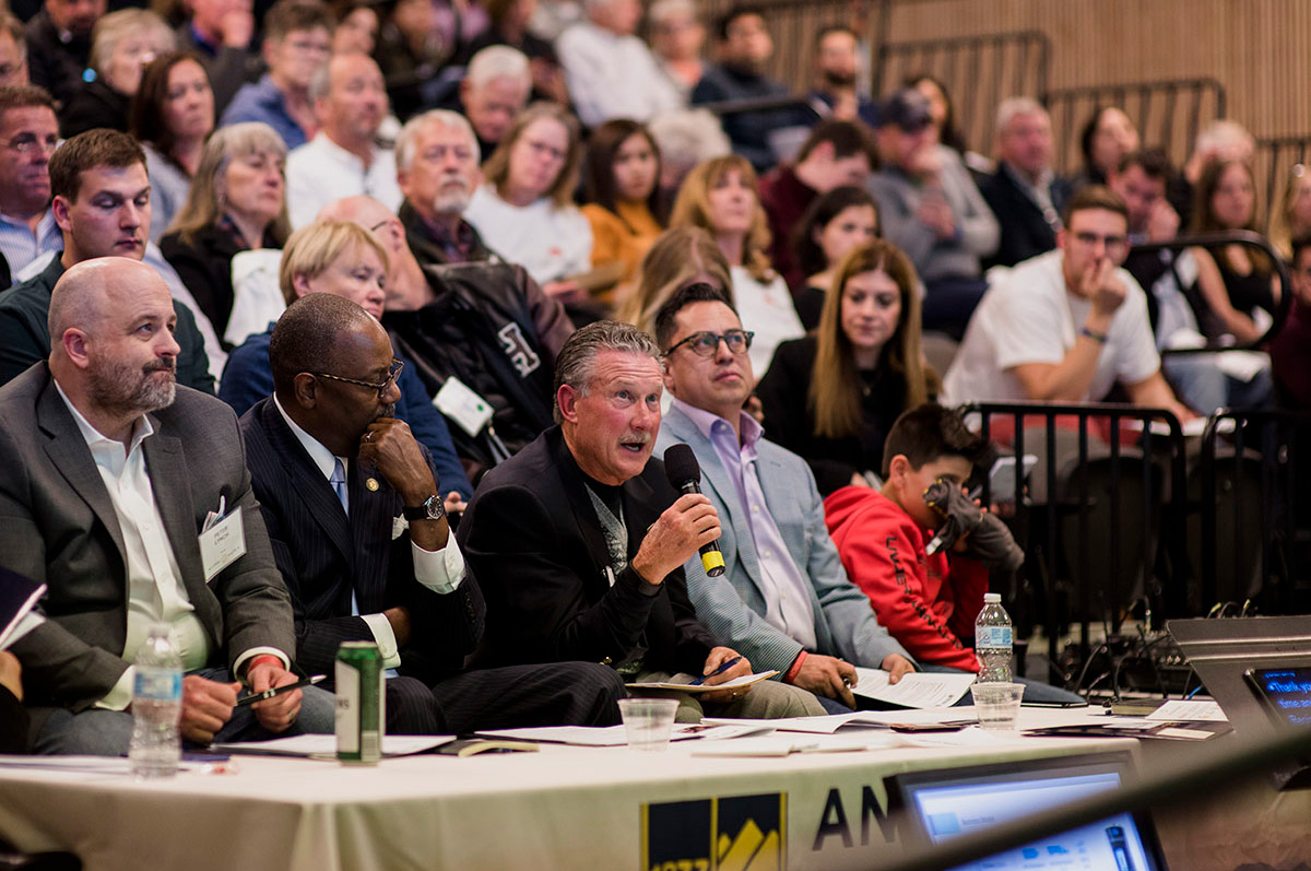 panel of judges and audience members watching a business pitch