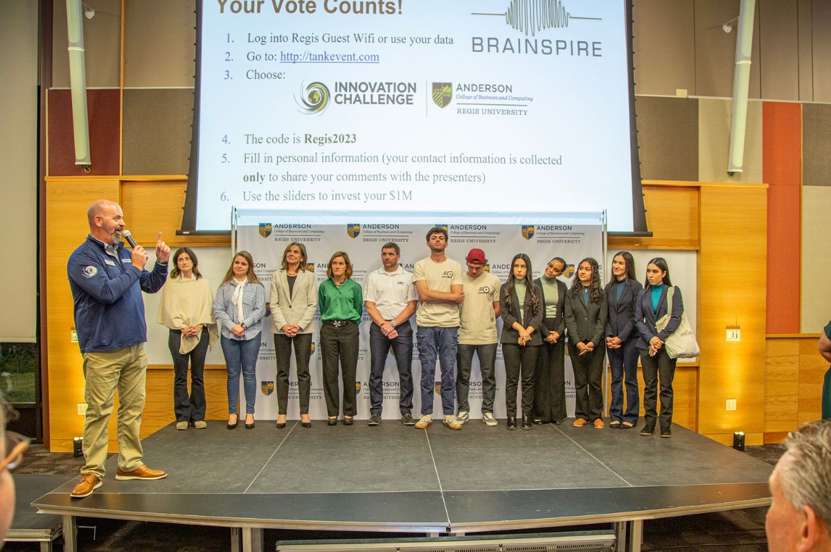 innovation challenge competitors stand on stage