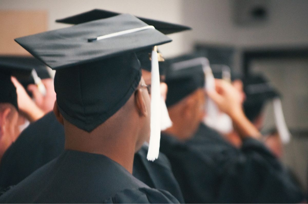 Line of people wearing graduation caps