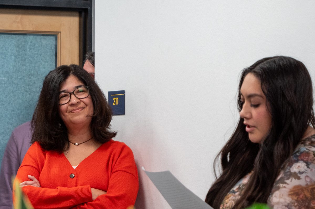 Nicki Gonzales smiles as a student speaks