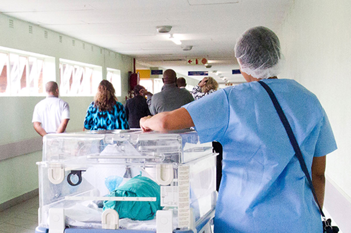 nursing walking with baby in incubator