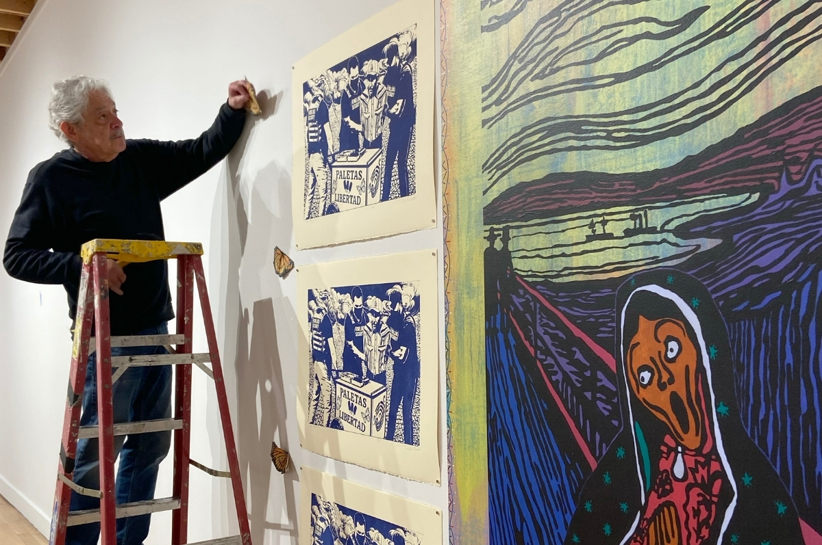Tony Ortega installing the exhibition