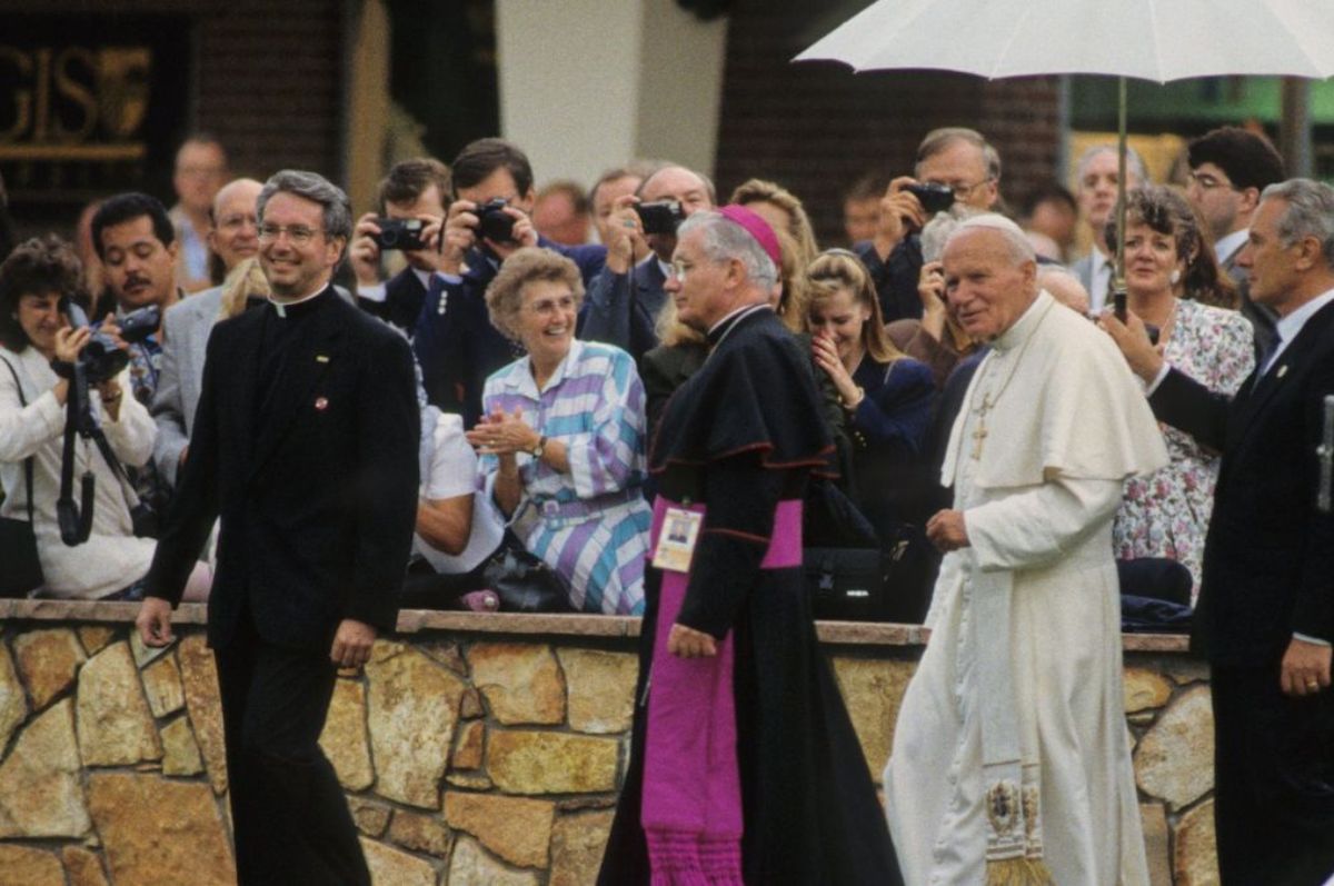 Pope John Paul II walks on the Regis campus