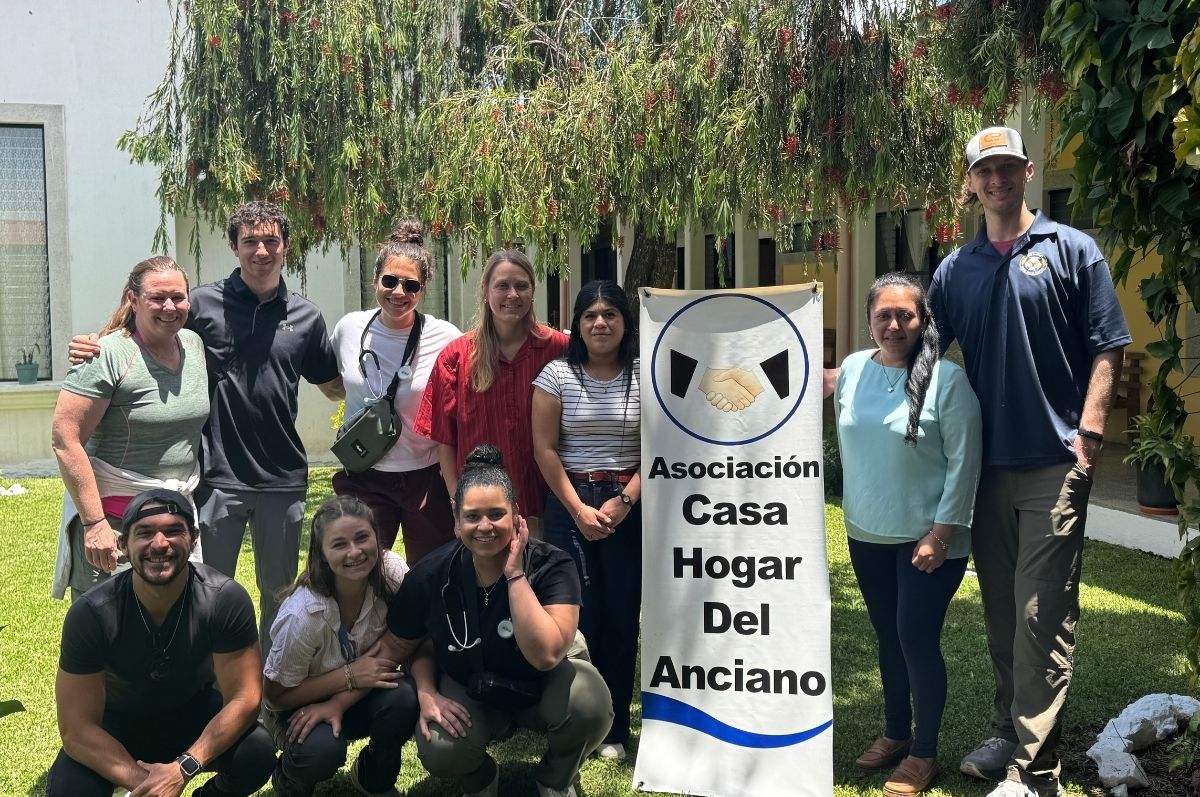Regis DPT students posed in front of one of their clinic opportunities