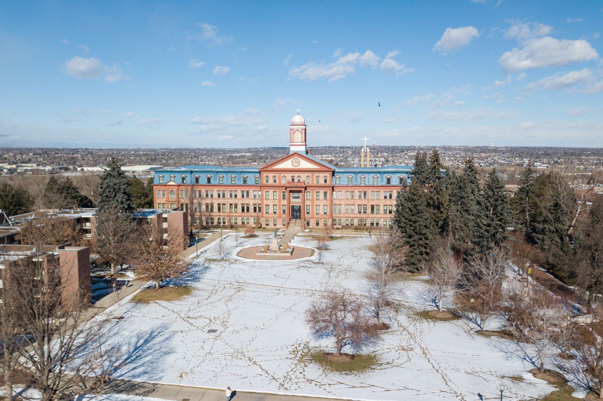 winter at Regis campus with Main Hall in background