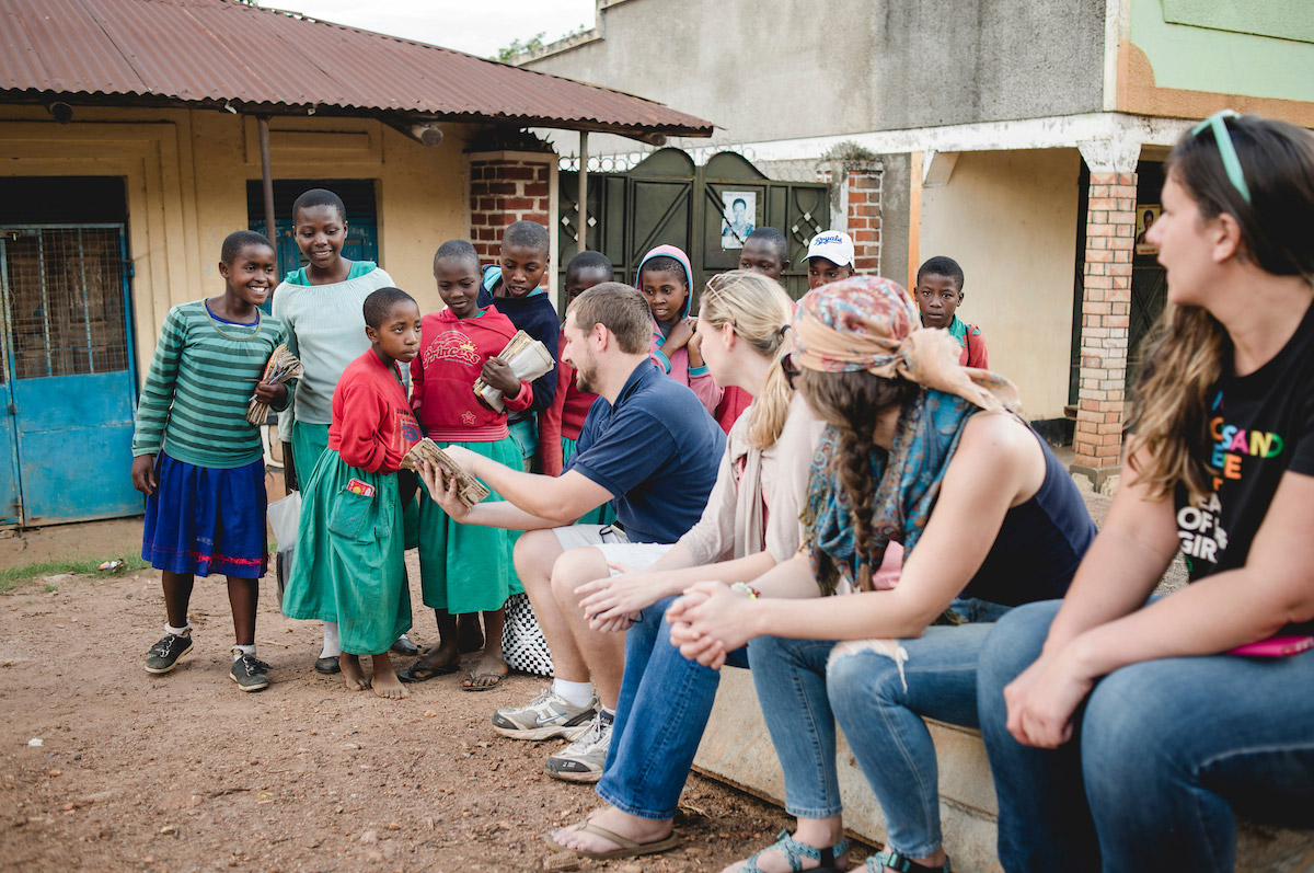 Regis University Master's of Development practice students talk to local children during an immersion trip 