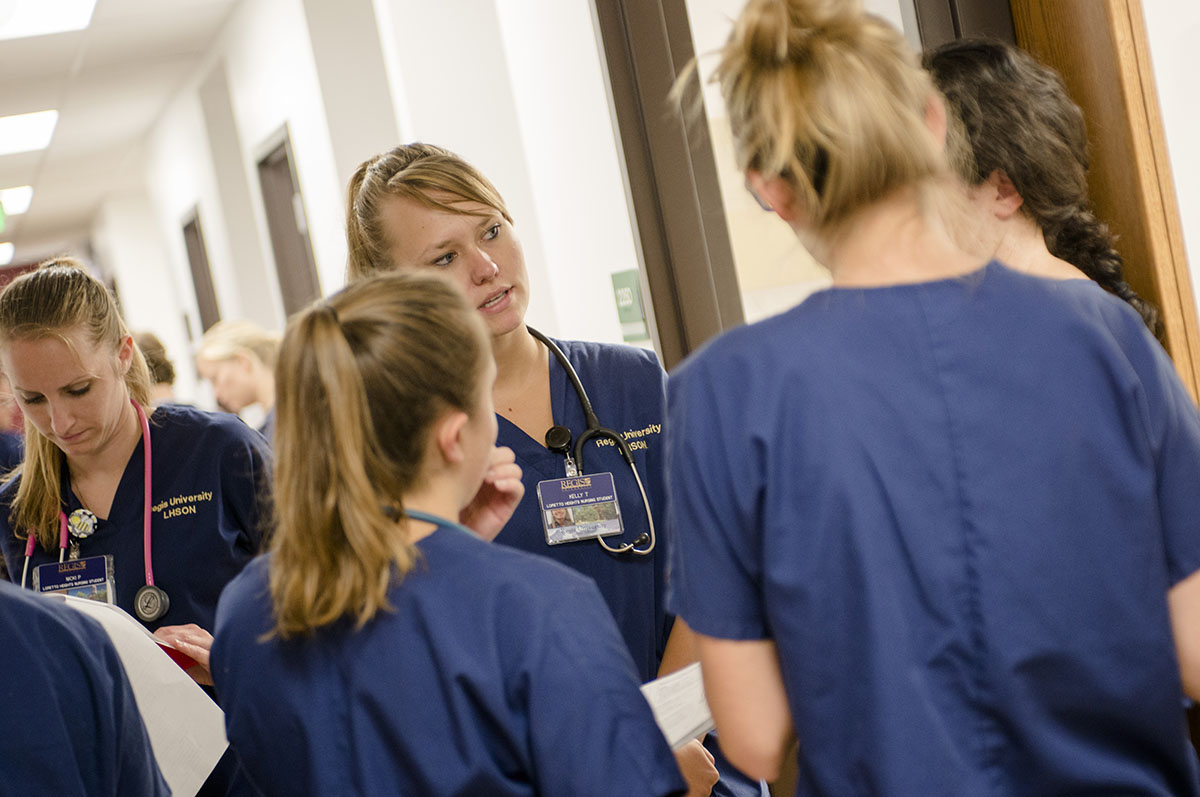 regis nursing students chatting