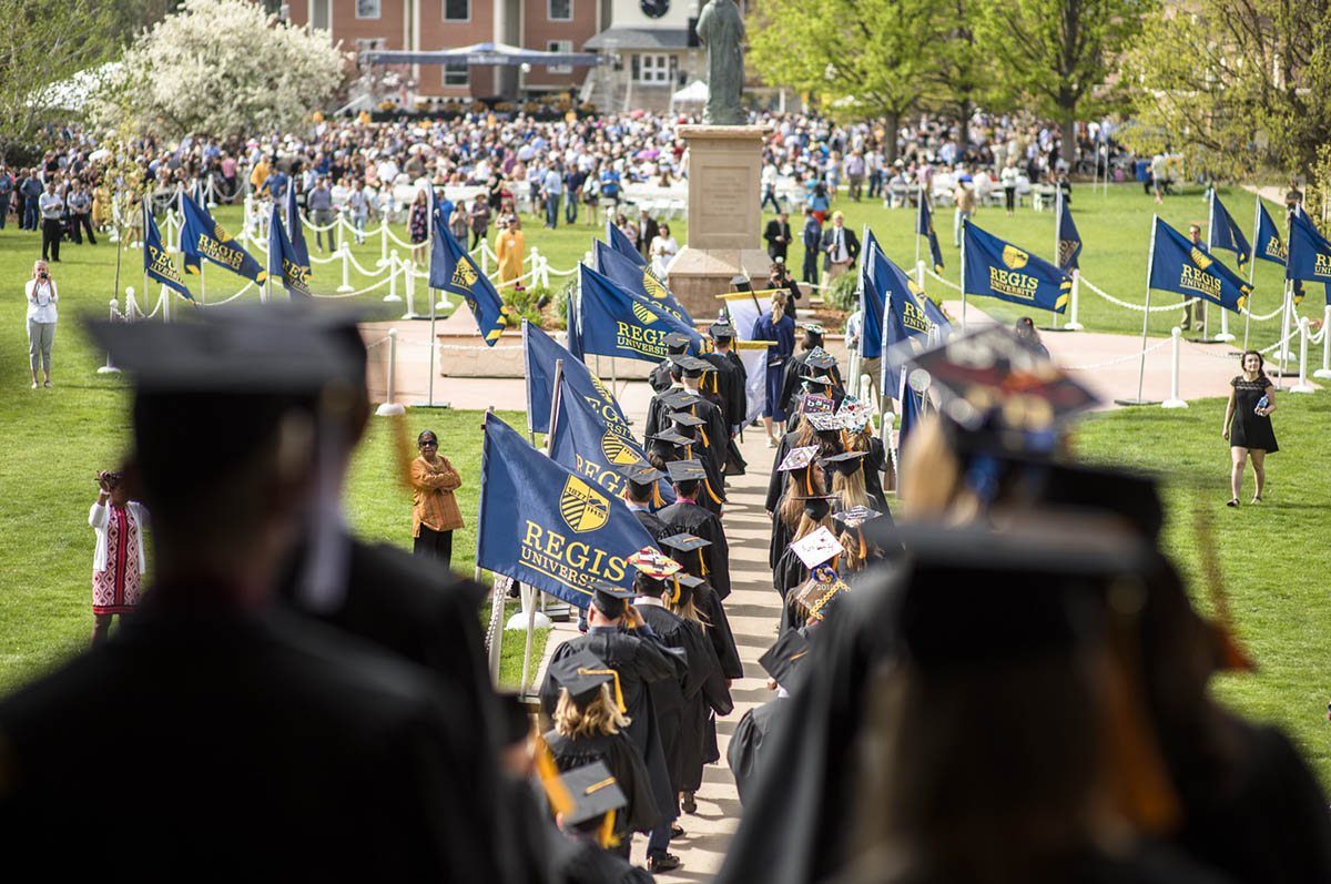 students walking into commencement