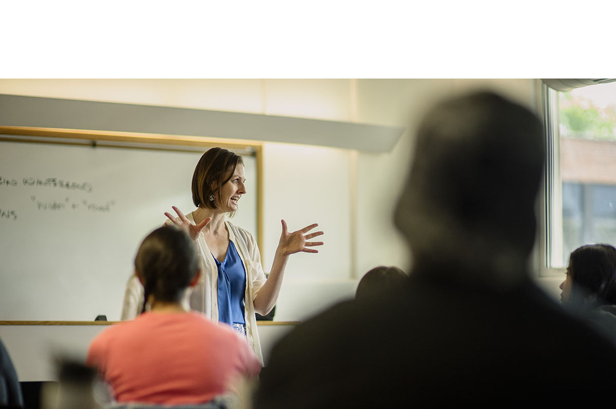 professor actively lecturing in classroom