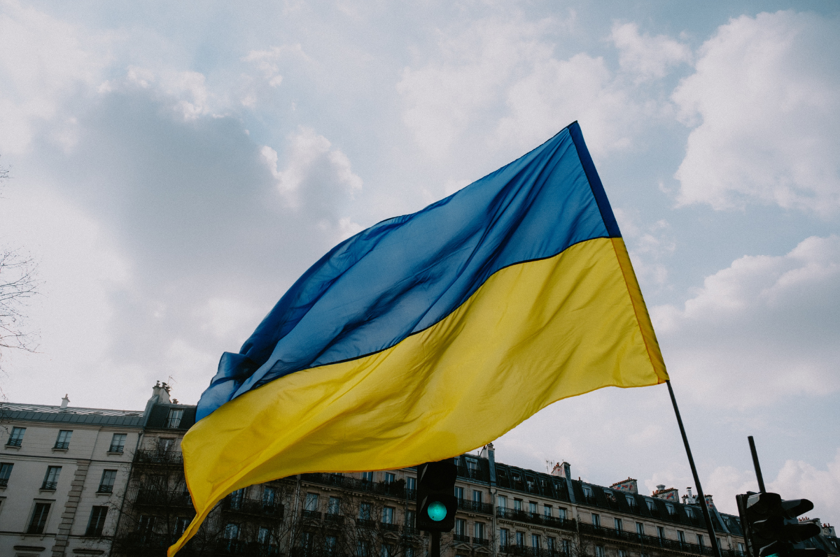 flag of Ukraine in front of buildings